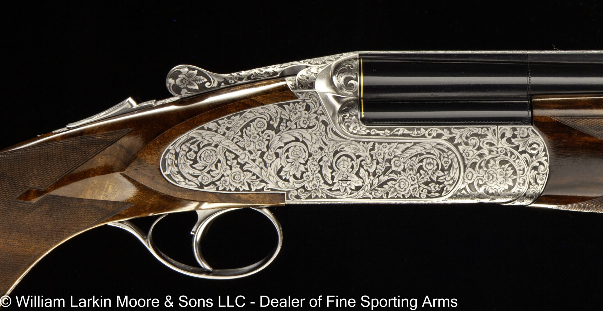 Ornately engraved double-barrel shotgun receiver